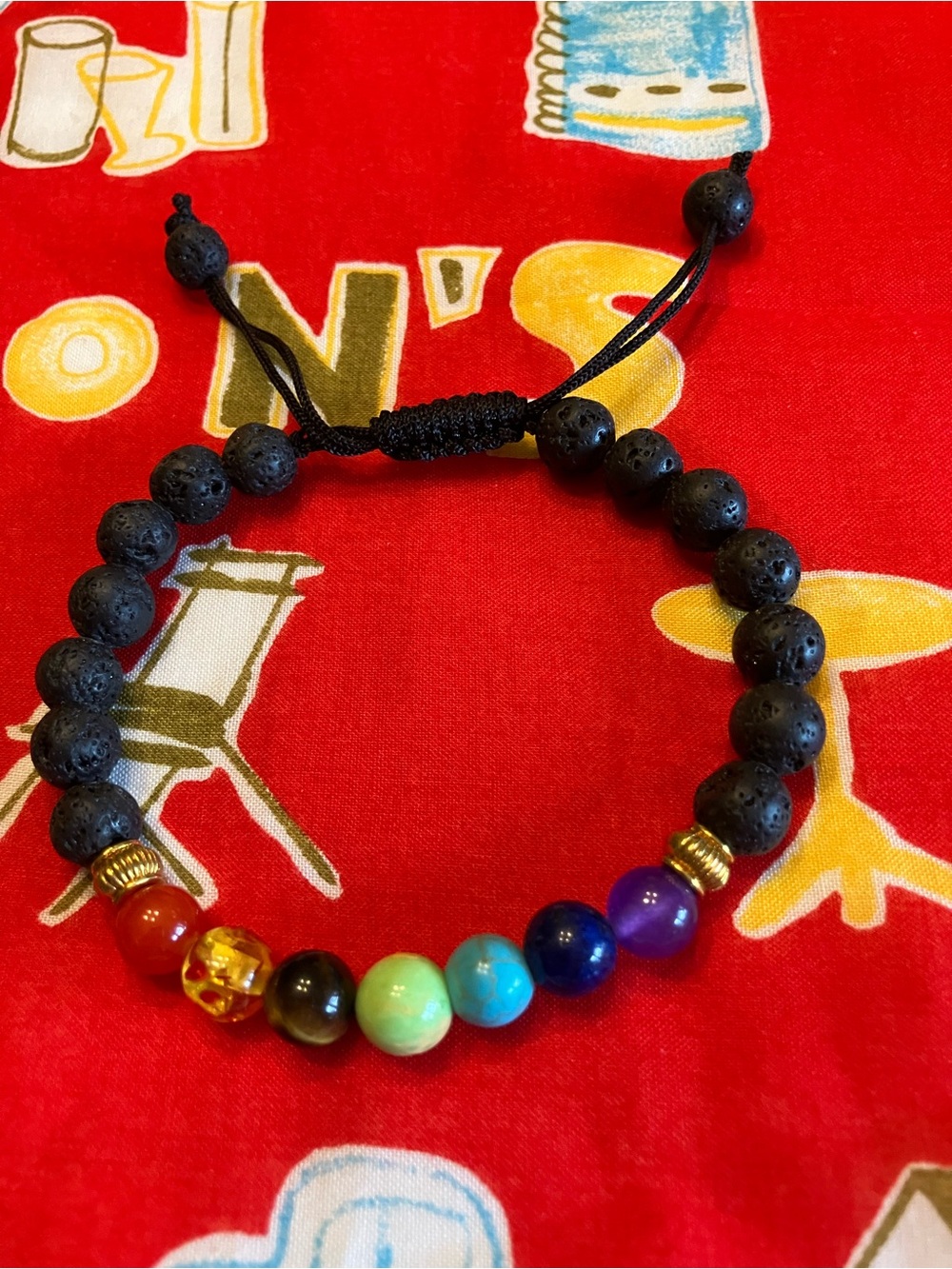LAVA BEAD AND  CHAKRA BRACELET WITH GOLD SPACERS AND 7 CHAKRA BEADS